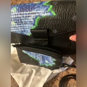 Like new authentic MCM millie tech flower crossbody bag and matching wallet.